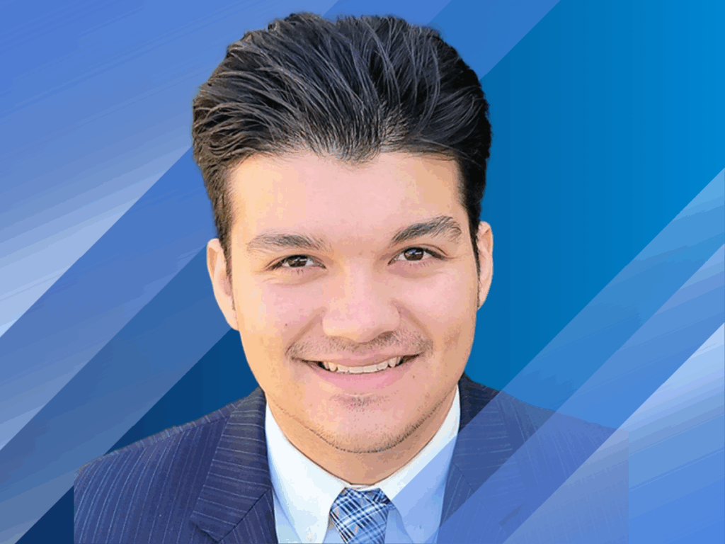 Emilio's headshot over a blue background