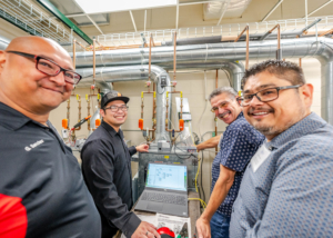 Four instructors from Texas apply teamwork to diagnose a faulty air handler.