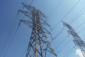 Worm's eye view of transmission towers and overhead power lines