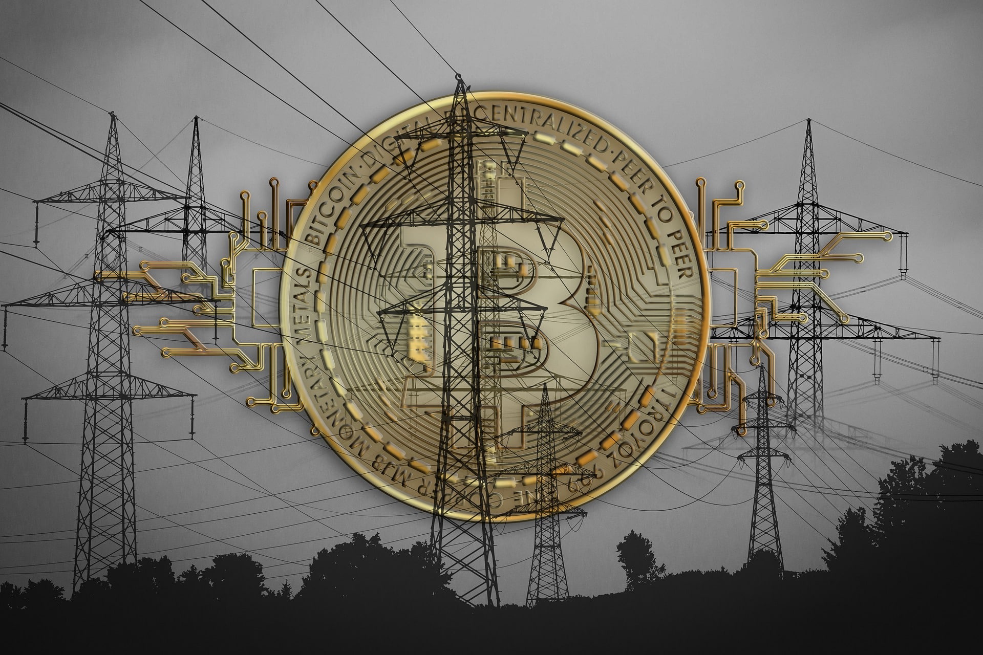 Silhouette of electric grid towers overlaid with an image of bitcoin.